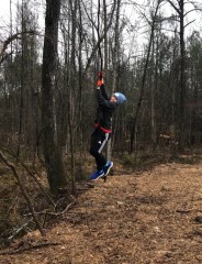 Colin swinging on a vine near our home