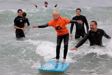 This is the first time I stood up on a board. Again, at a Mauli Ola surf experience day.